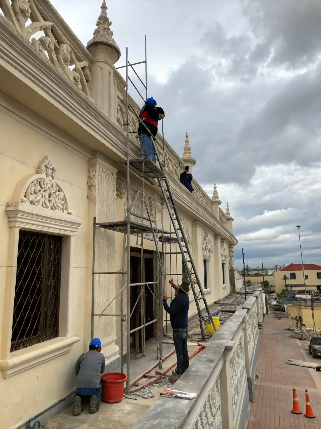 A photograph showcasing the intricate stonework restoration in progress at the Saint Gonéry Chapel, with scaffolding visible and artisans carefully working on the facade.